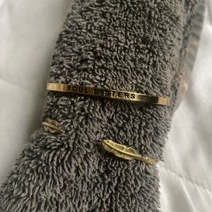 Two adjustable brass cuff bracelets